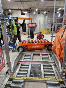 E wagon being hoisted down to lower level